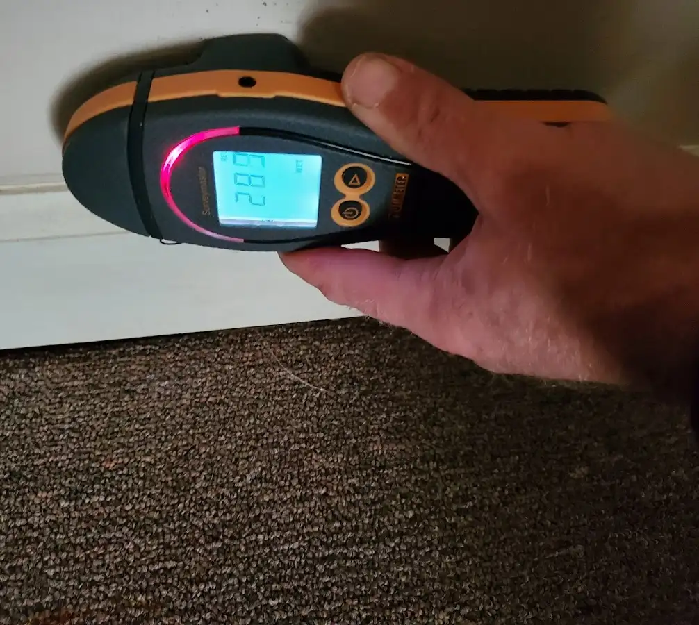 Moisture detection at baseboard during Storm Damage Restoration in Bossier City